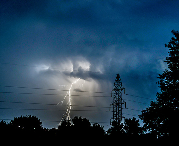 Powerlines and lightning/American Public Power Association-Unsplash