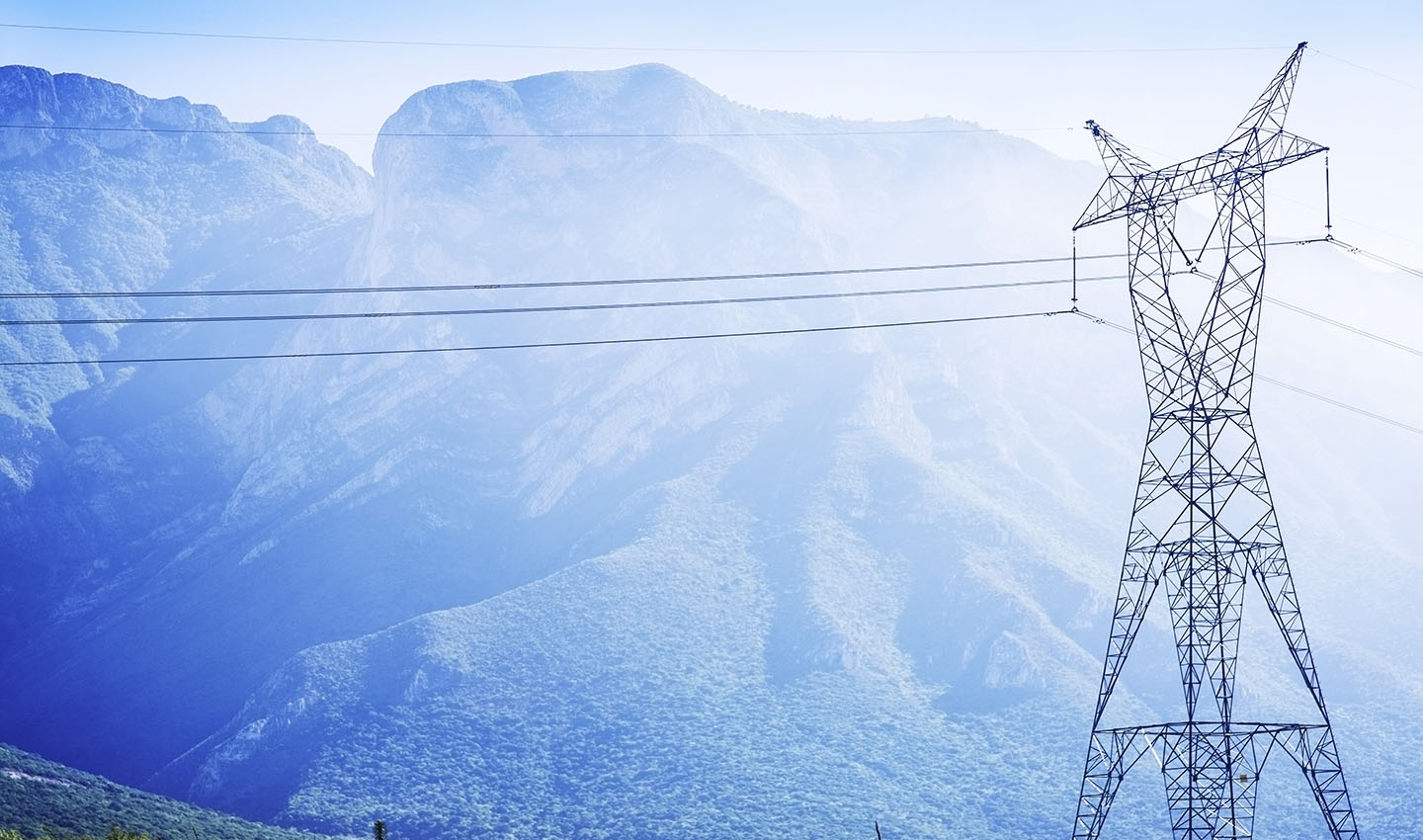 Electricity pylon and mountain