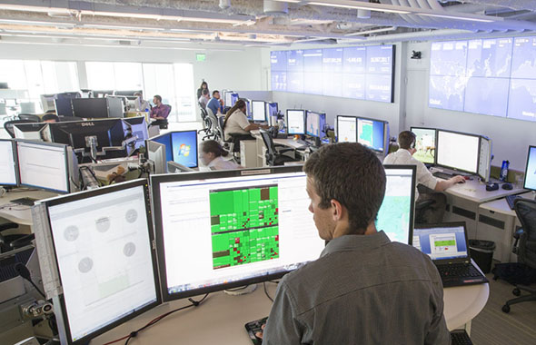Engineer showing Enel X battery energy storage technology