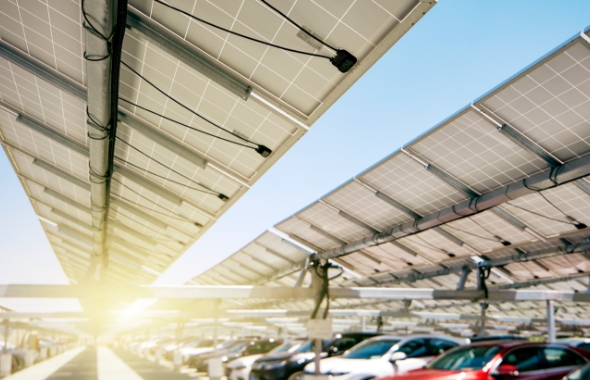 parking lot with solar panels above
