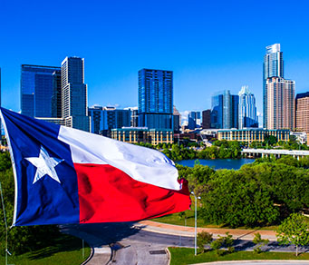 Texas flag and Austin skyline