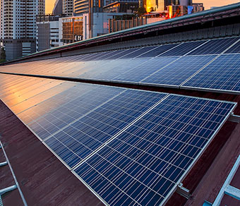 solar panels on rooftop in city